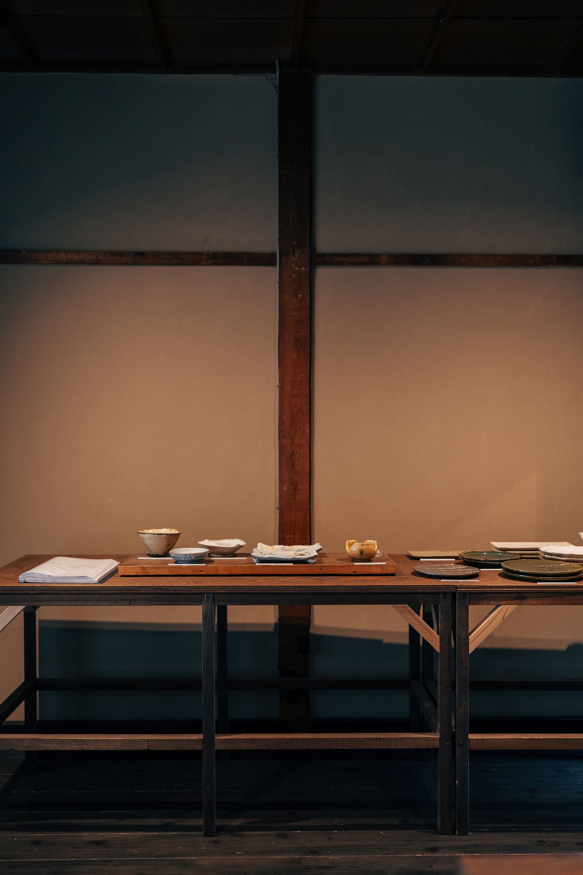 A serene Japanese tea room interior with wooden table settings in Kyoto, showcasing traditional aesthetics.