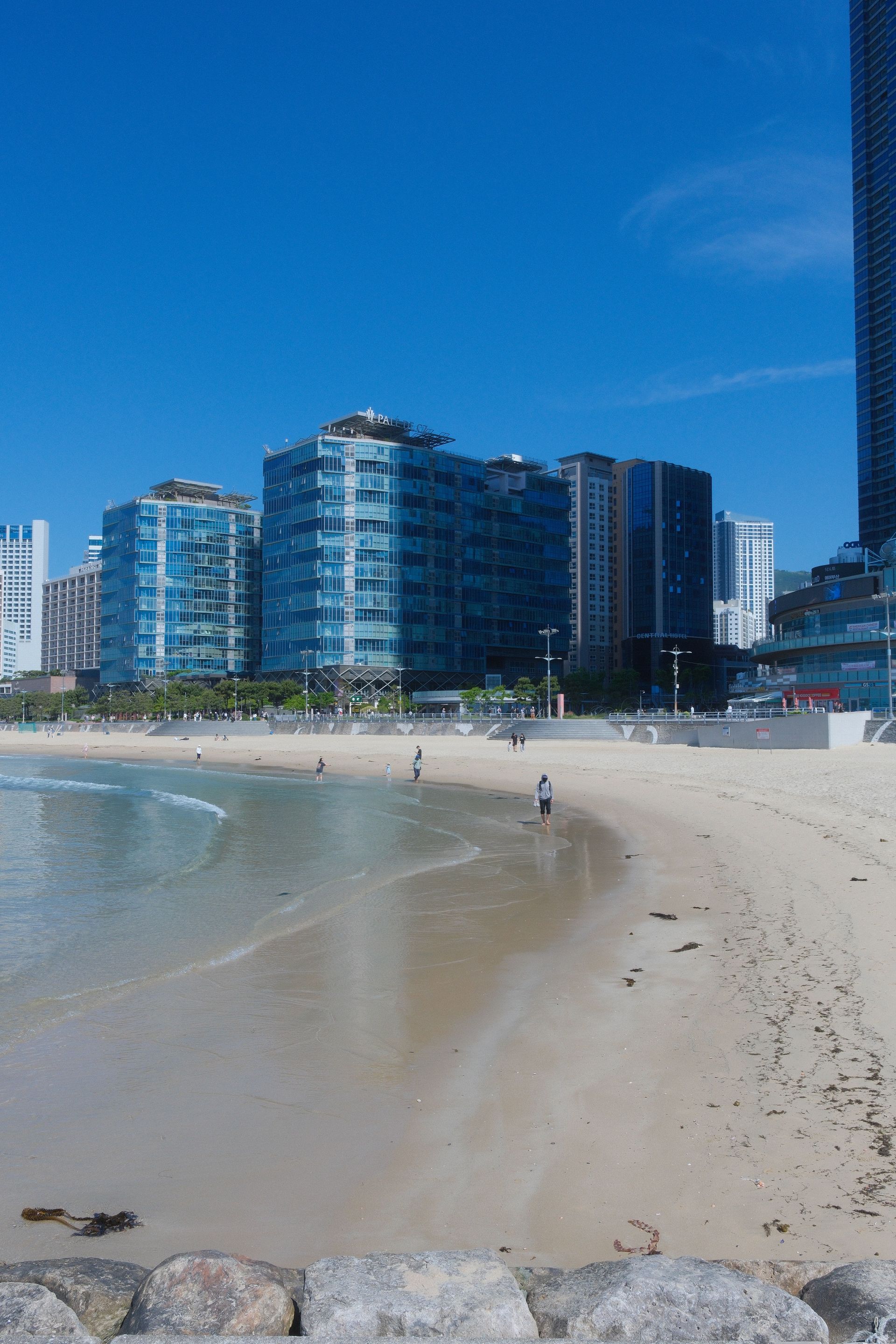Scenic view of urban beach with modern buildings in South Korea.