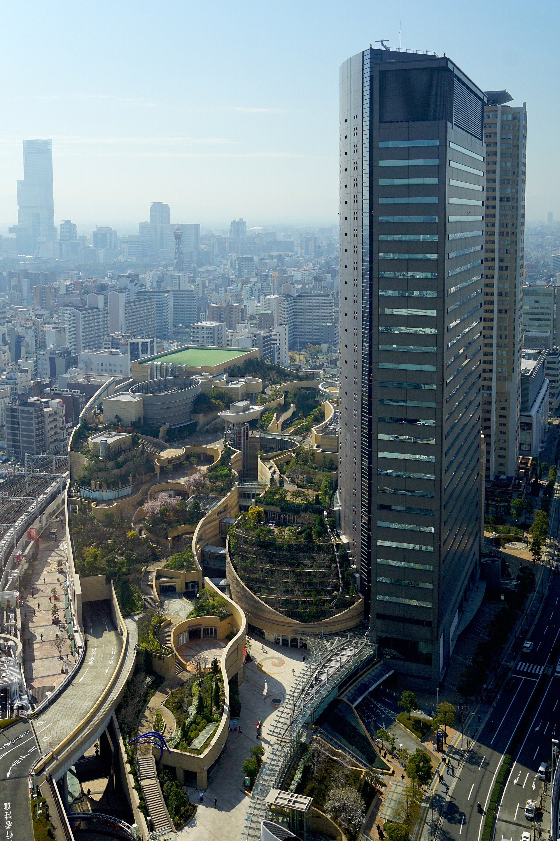 Stroll through bustling Namba in Osaka, Japan, with iconic Tsūtenkaku Tower soaring above.