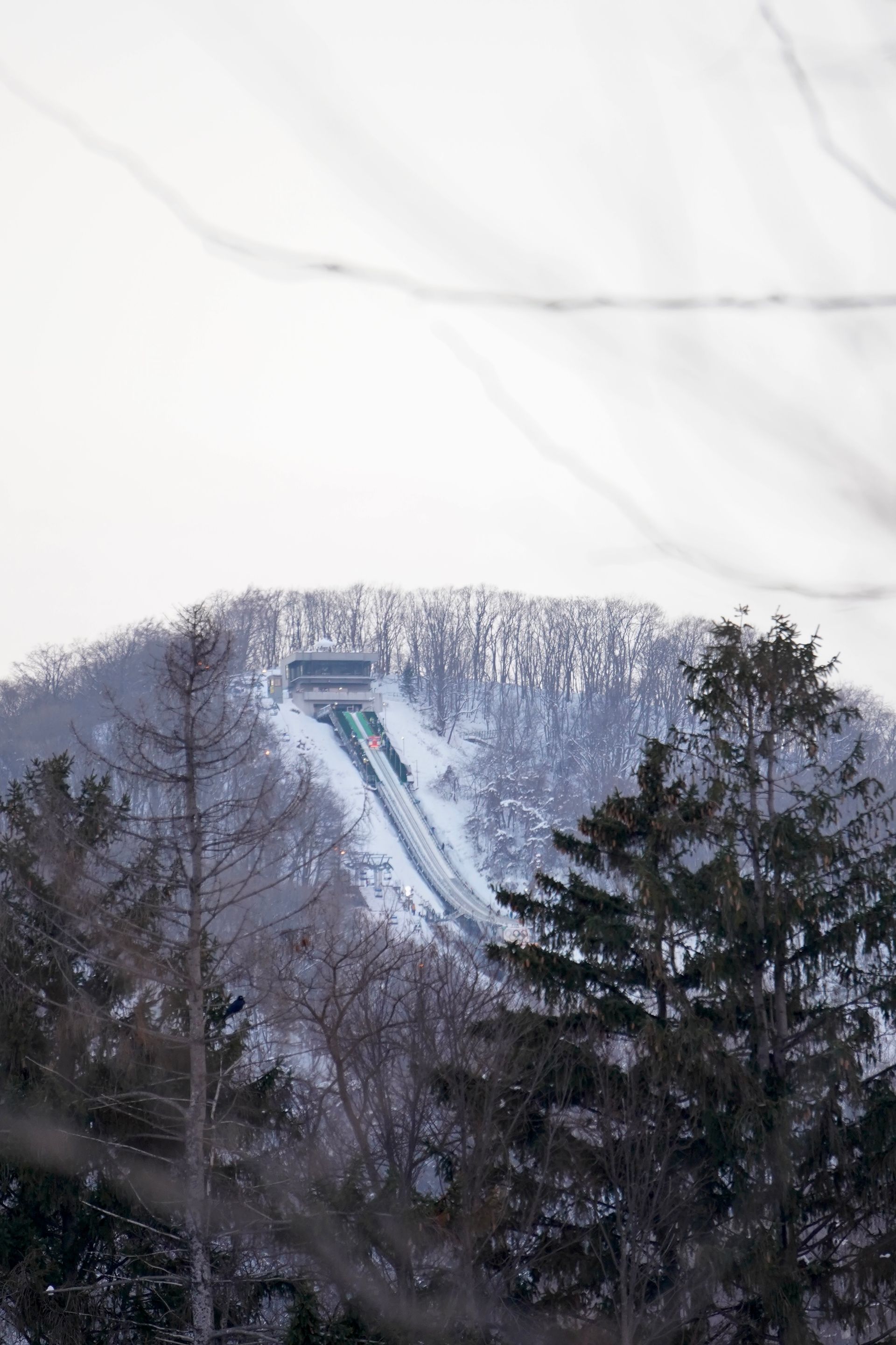 Snowy landscape featuring the Okurayama Ski Jump in Sapporo, Hokkaido.