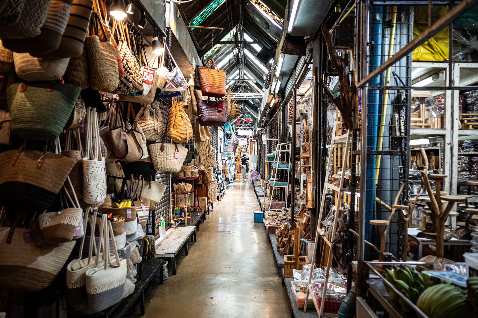Explore the vibrant and busy Chatuchak Weekend Market in Bangkok; perfect for shopping enthusiasts.